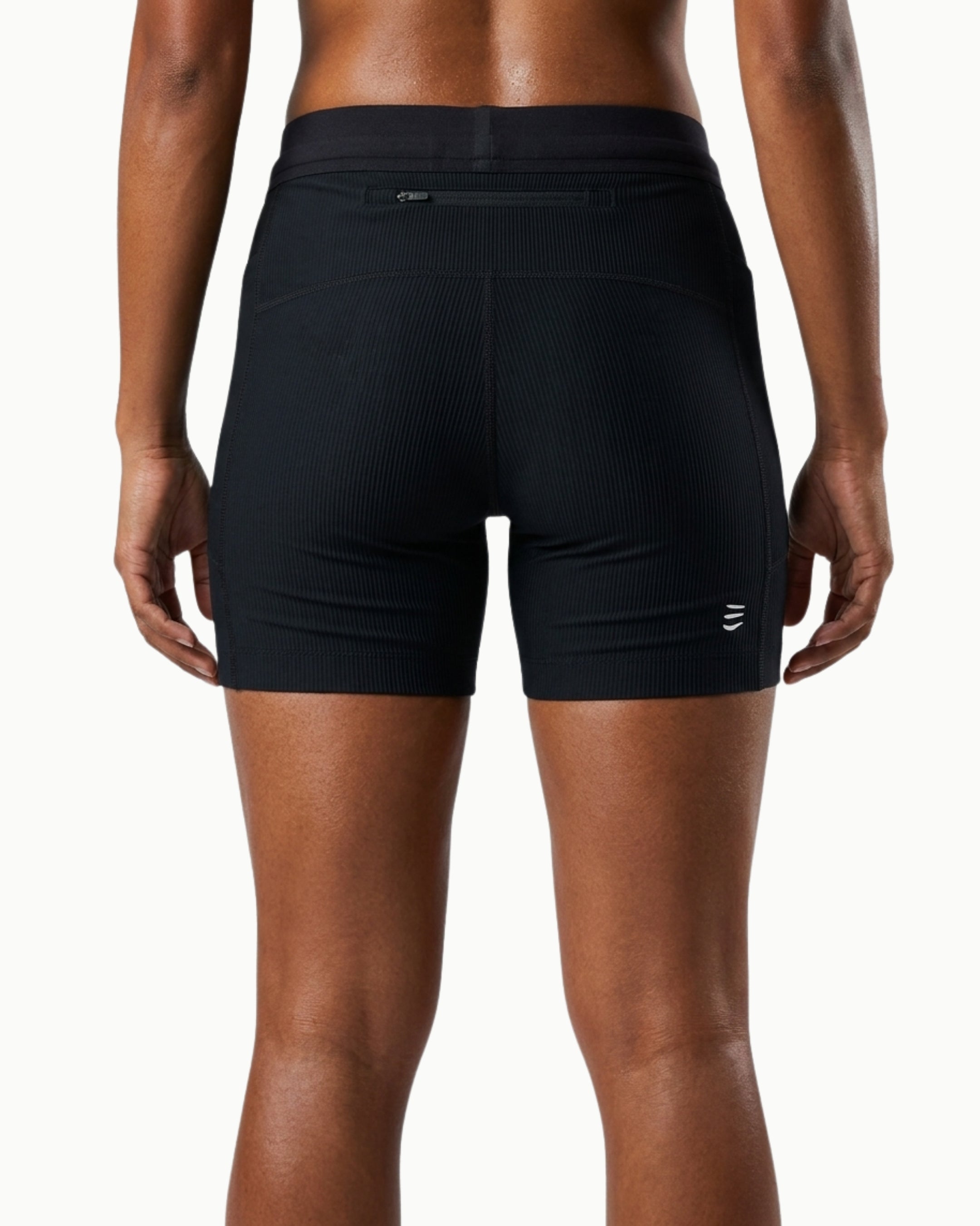 Women's Contour Short in Black, back view showing zip stash pocket