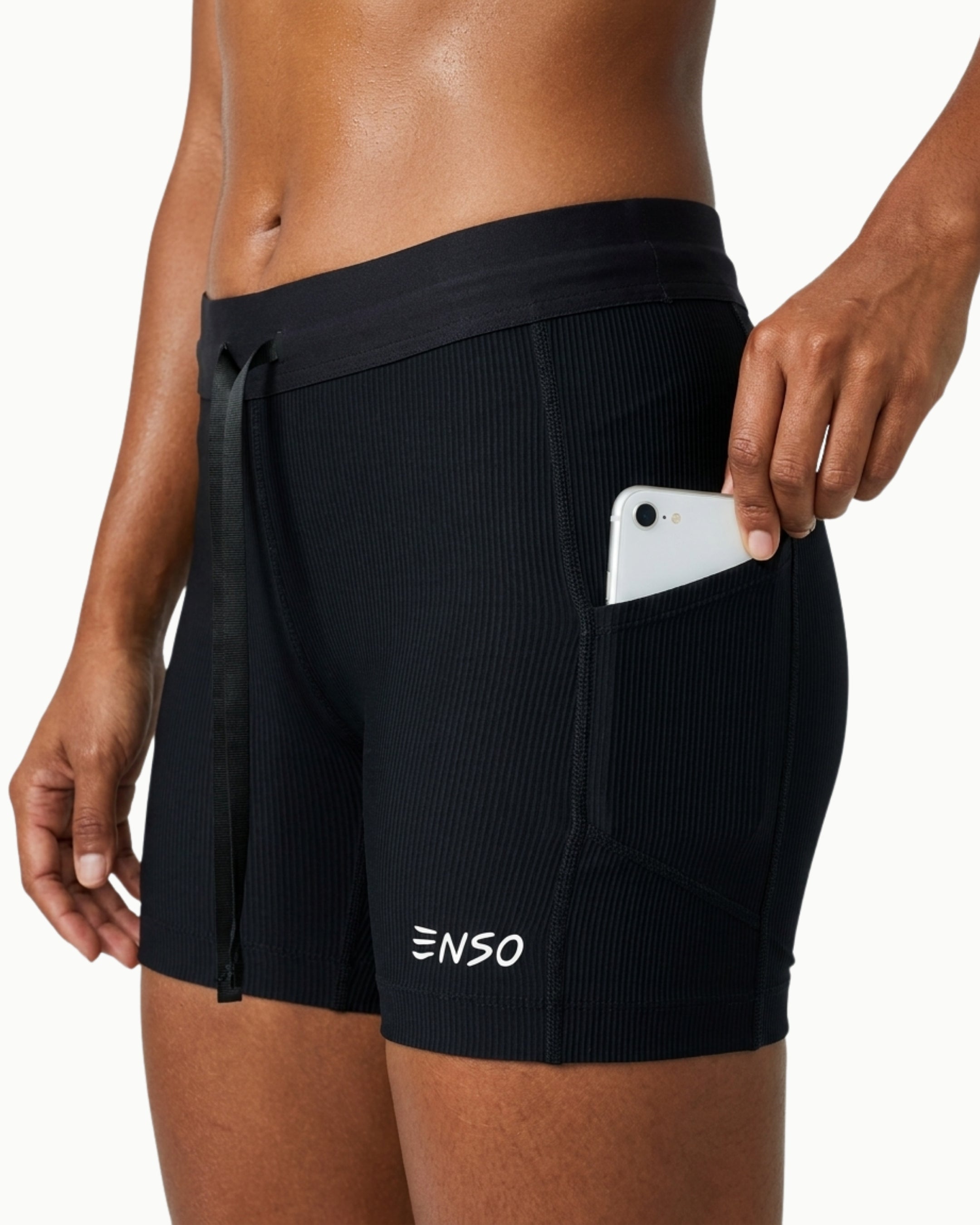 Women's Contour Short in Black, front view showing waterproof phone pocket