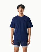 Unisex Origin Tee in Navy, front view on male model