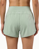 Women's Training Short in Desert Sage, back view on model